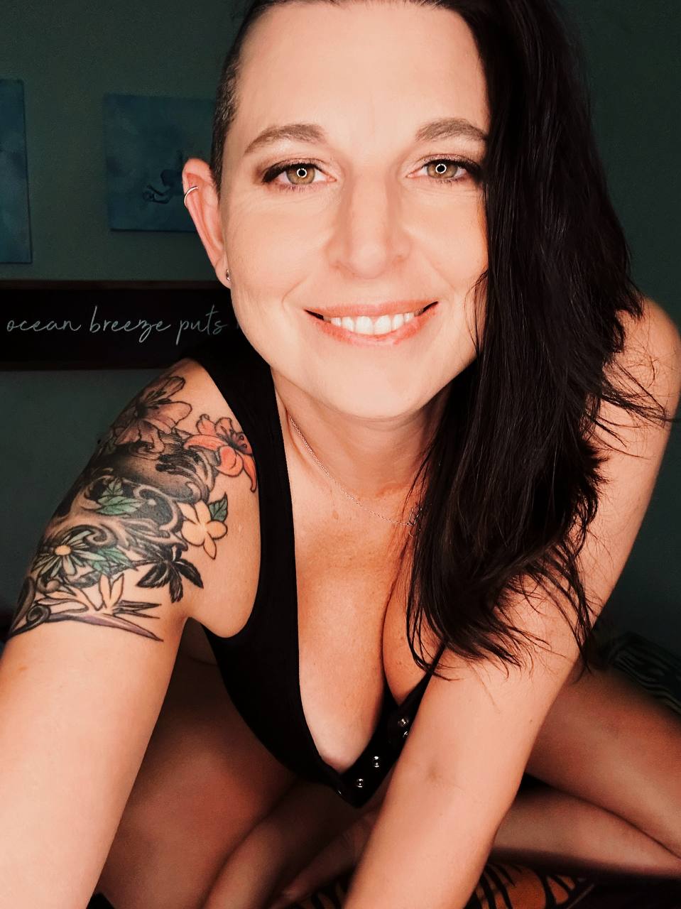 Happy Hotwife black bodysuit portrait — what is cuckolding cuckold meaning