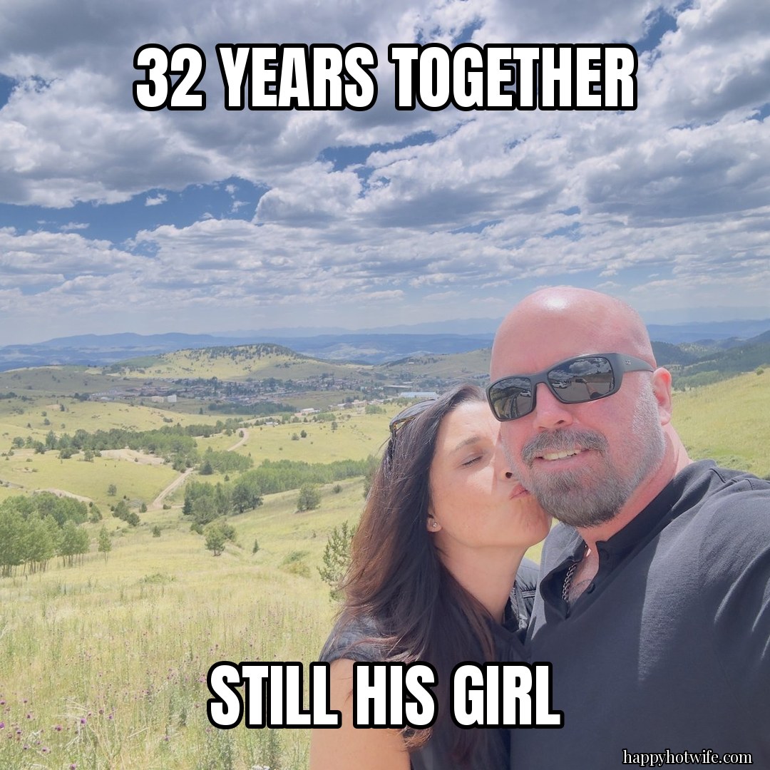Hotwife meme: "32 years together" "Still his girl". Happy Hotwife kissing her husband's cheek on a hilltop.