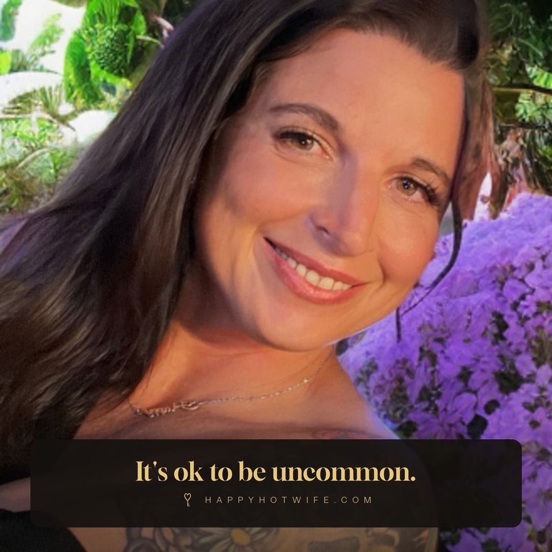 "It's ok to be uncommon." Quote from Becoming Happy Hotwife. Happy Hotwife smiling beside purple flowers.